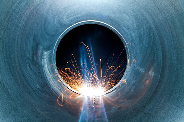 Welding Weld sparks in the tube metalwork stock pictures, royalty-free photos & images