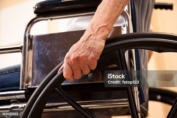 Senior Womans Hand On Wheelchair Stock Photo - Download Image Now - Americans with Disabilities Act, Senior Adult, Low Angle View