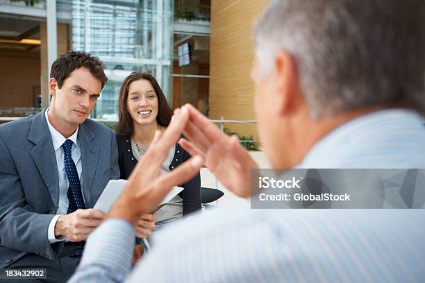 Discussing Business Strategy Stock Photo - Download Image Now - 40-49 Years, 50-59 Years, Active Seniors