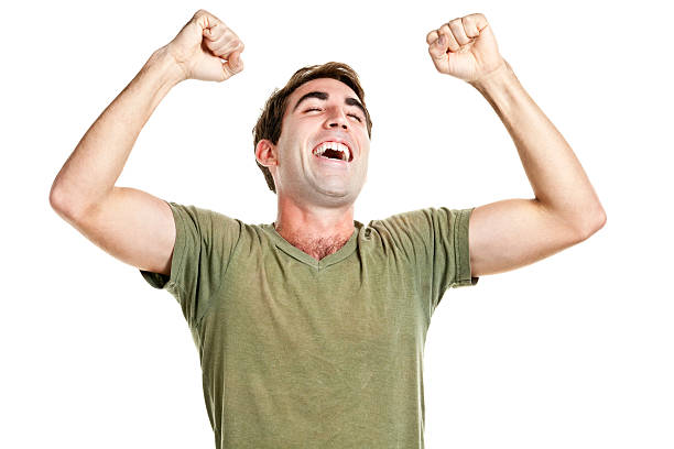 eufórico hombre feliz aclamando y agitación fists - cheering men t shirt celebration fotografías e imágenes de stock