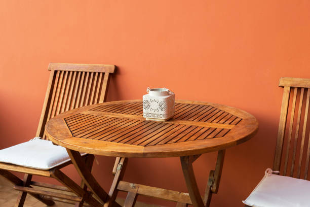 istock empty wooden table and chairs on the terrace on a summer day 1834333292