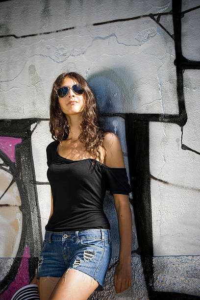 istock Young Women Posing Against Urban Murales Wall 183433795