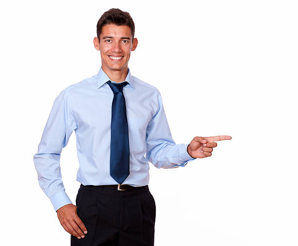 istock Attractive young man pointing to his left 183439405