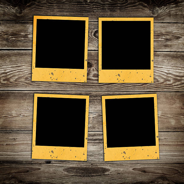 istock photo frames on wooden background 183439704