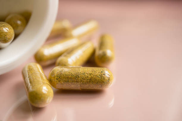 istock A handful of pills on pink background 1834431075