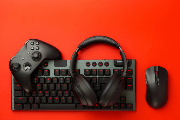 istock Gamer equipment on red background top view 1834436887