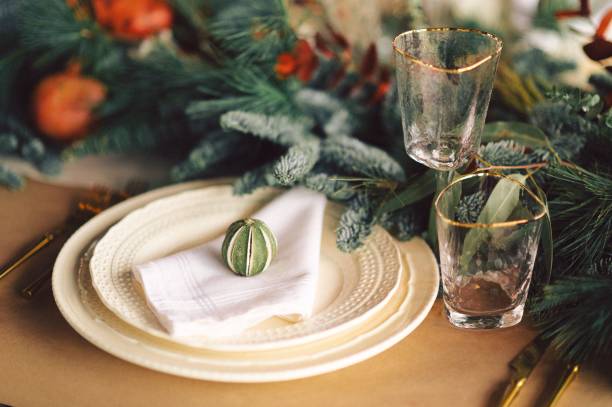 istock Festive and elegant Christmas dinner setting with ornate golden-plated silverware 1834451893