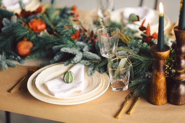 istock Festive and elegant Christmas dinner setting with ornate golden-plated silverware 1834452659
