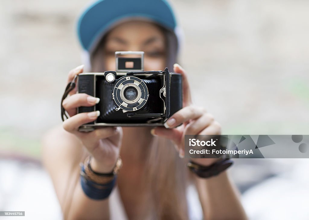 Young, beautiful woman with retro camera. Hipster style. outdoor shot. Free of Charge Stock Photo