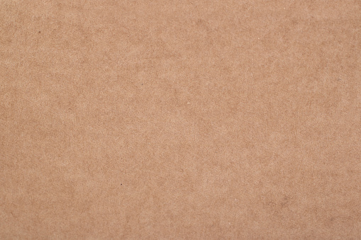 Texture of brown paper sheet as background, top view