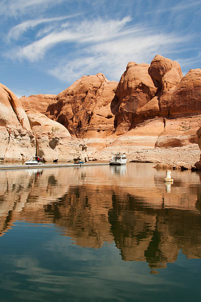 Lake Powell Tours come and bring people on Lake Powell via boats in order to go and see Rainbow Bridge glen canyon stock pictures, royalty-free photos & images