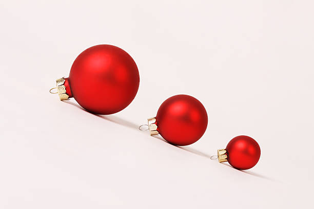 istock Row of three red matt different sizes christmas balls 183448792