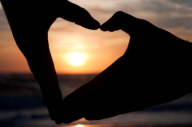 istock Hands forming a heart at the sunset 183448990