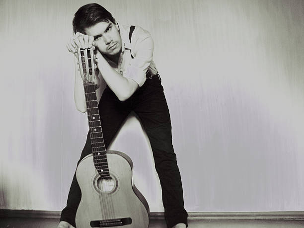 istock The guy is standing with his guitar 183449128