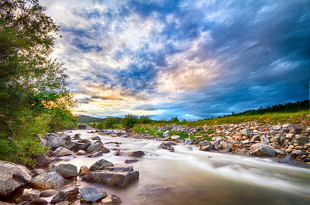 Scenic landscape view of a slow flow South Boulder Creek at sunset in Rollinsville Colorado,  west of Boulder.
