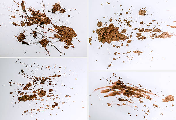 Mud splashes Texture clay moving in white background. mud stock pictures, royalty-free photos & images