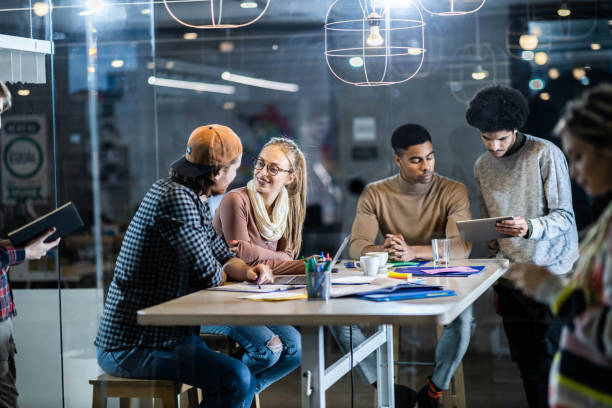 istock Large group of multi-tasking freelancers working in the office. 1834530587