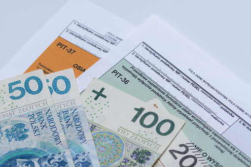 Polish banknotes lie on tax forms