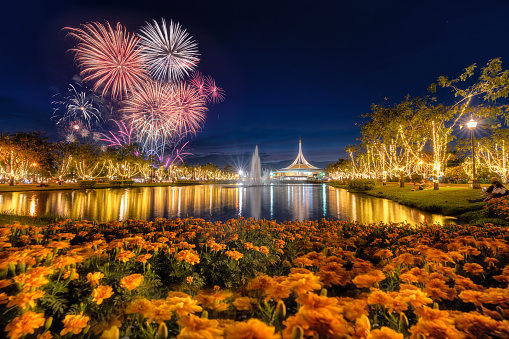 Fireworks at the lake. Garden in Thailand. Fireworks show and prople looking at it at Suanluang Rama 9 park in Bangkok, Thailand. Dec 10, 2023