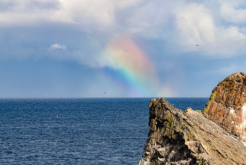 Rainbow over the sea on Scotland coast