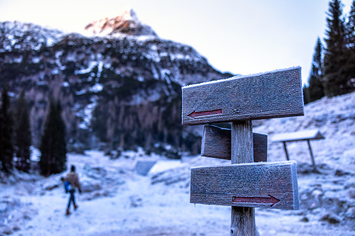Hiking Copy Space Directions Wooden Boards in Winter Morning Frozen Landscape in Julian Alps