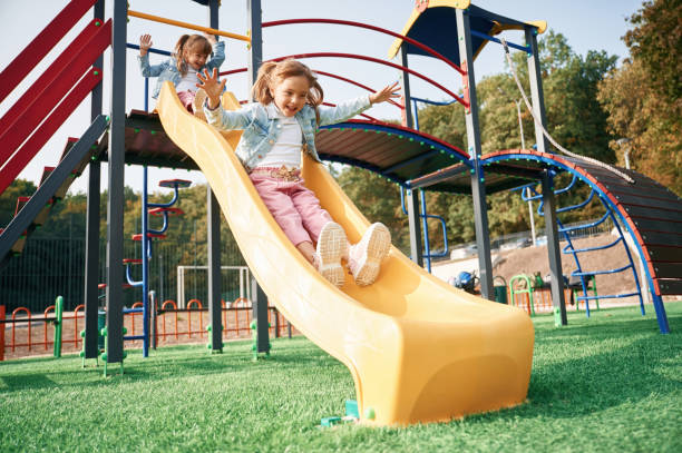 istock On the playground slide. Kids are having fun 1834630607