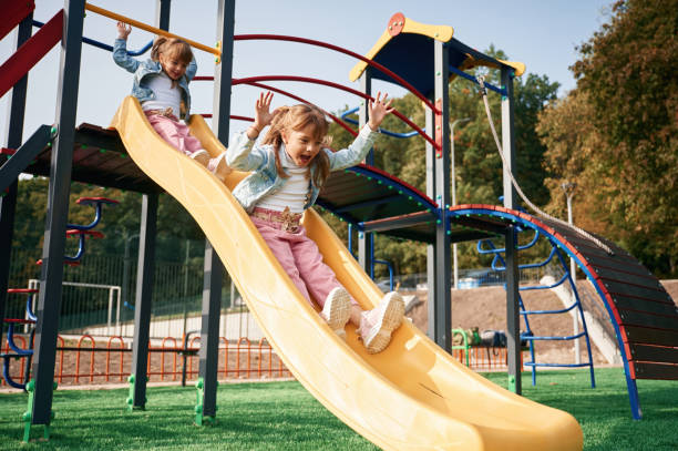 istock On the playground slide. Kids are having fun 1834631157