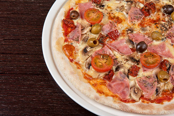 istock pizza with ham and mushrooms 183463314