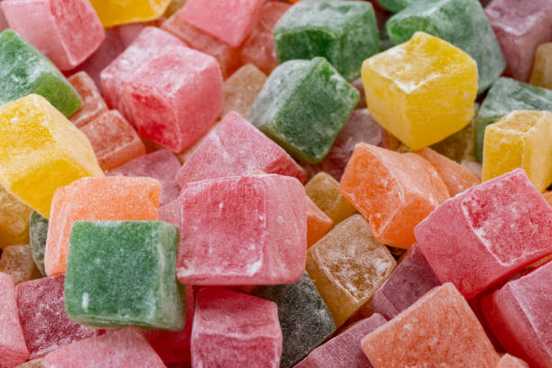 istock Closeup of multicolored cubes Turkish delight (Lokum). Selective Focus. Flat lay. 1834637803