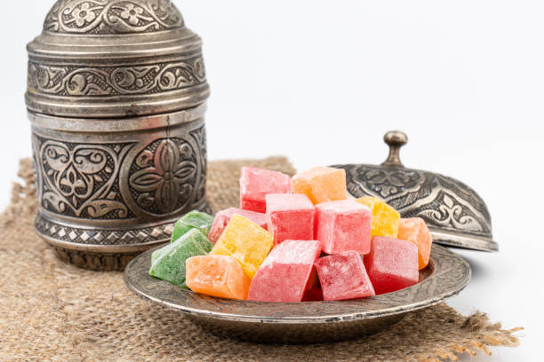 istock Turkish Coffee with Turkish Delight on authentic metal plate, isolated on white background 1834637819