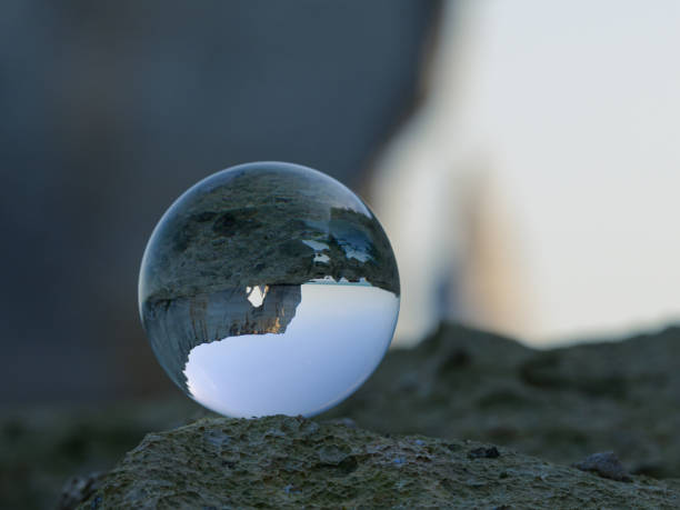 istock Chalk cliffs of Etretat seen through glass sphere 1834661213