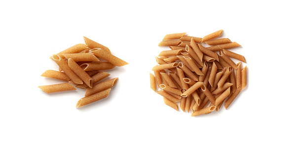 Raw Brown Pasta Isolated, Wholegrain Penne Pile, Dry Whole Grain Noodle, Raw Spelt Macaroni, Healthy Italy Food, Organic Meal, Wholewheat Pasta on White Background