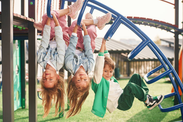 istock Cheerful kids are having fun on the playground 1834664946