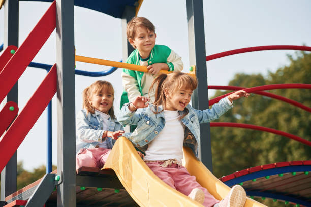 istock On the playground. Kids are having fun together 1834664961