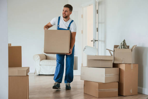 istock Room full of boxes. Moving service employee 1834678651
