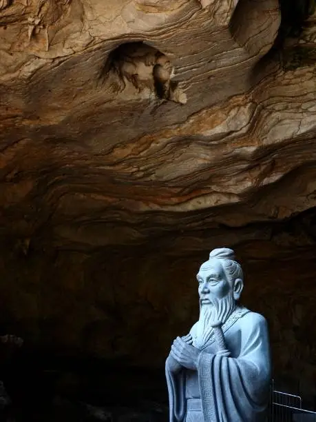 A statue of Confucius at Kek Look Tong cave in Ipoh, Malaysia. $