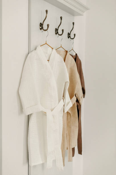 istock Linen bathrobes hang on a hanger in the bathroom 1834701794