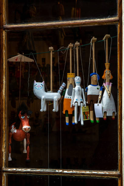 Prague, Czech Republic - May 29, 2016: Shop window with old-style puppets in Prague