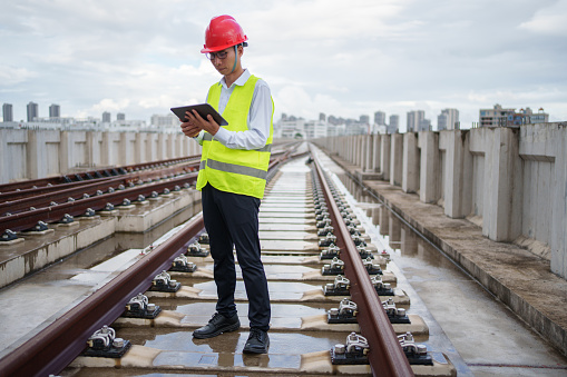 Railway worker using tablet computer