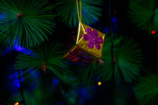 Christmas decoration. Hanging Gift Box on pine branches