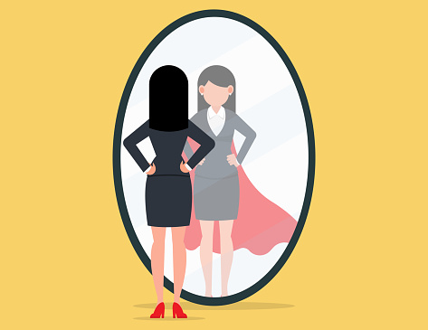 Self confidence, Business leadership. Business woman looking at his strong ideal self superhero reflection mirror.
