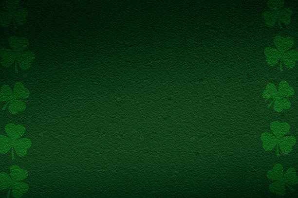 istock Background of St. Patrick's Day with Green Shamrocks. Green clover leaves with space for text. 1834732349