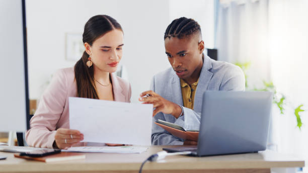 istock Laptop, diversity and business people collaboration, communication or teamwork on work flow analysis. Notebook planner, discussion talk and black man, woman or team cooperation on research statistics 1834738171
