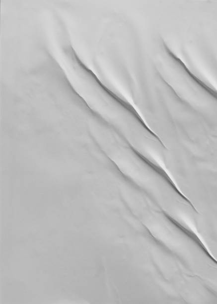 istock Background image of a vertical thin gray paper with a crumpled surface 1834740602