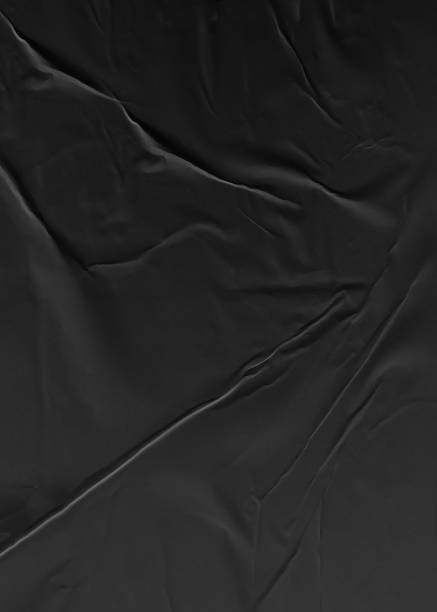istock Background texture of crumpled thin black paper 1834742798
