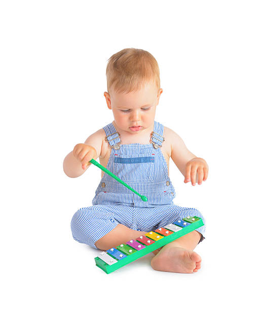 istock Cheerful baby boy and xylophone 183476740