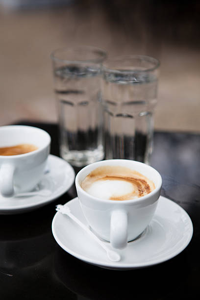 istock Two cups of coffee and water 183477261