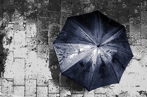 Umbrella captured from a high angle in black and white