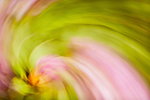 Colour abstract created by spinning the camera to create graphic blurred shapes from environmental objects