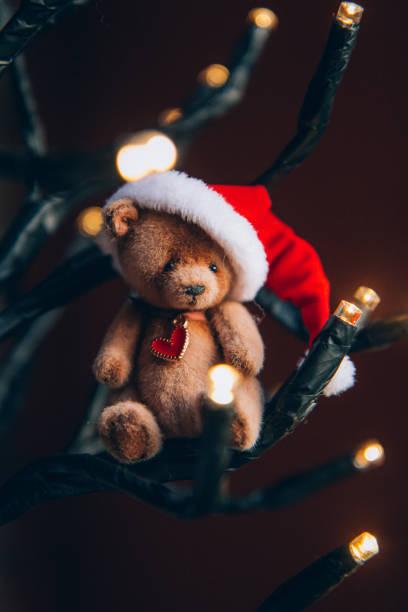 istock Cute hand made toy bear with Christmas Santa hat 1834862941